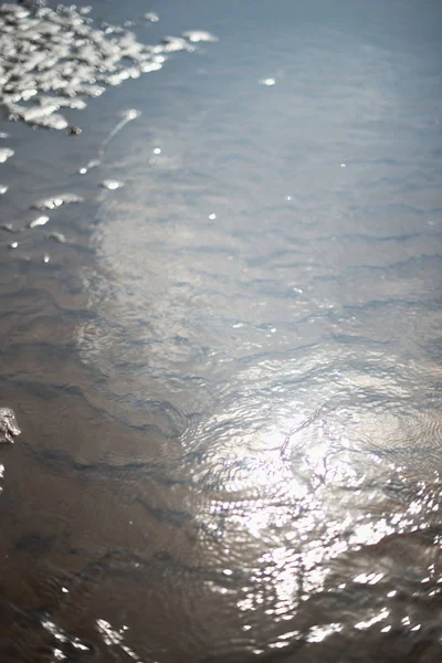 Textura de areia molhada ao sol — Fotografia de Stock