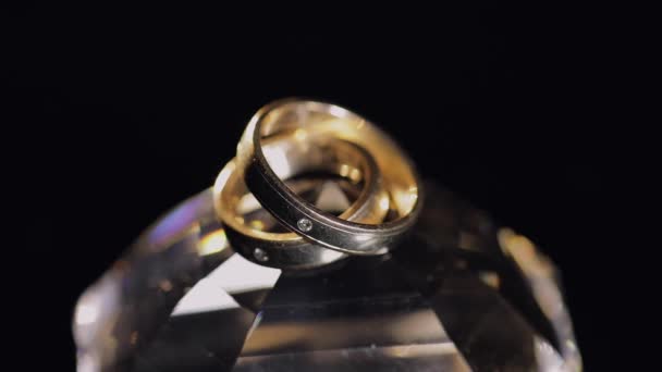 Wedding Rings Lying Crystal Shining Light Close Macro Black Background — Stock Video