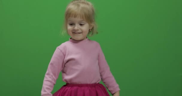 Happy three years old girl. Cute blonde child. Dancing and make faces — Stock Video