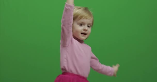 Happy three years old girl. Cute blonde child. Dancing and make faces — Stock Video