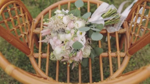 Beautiful wedding bouquet on the chair — Stock Video