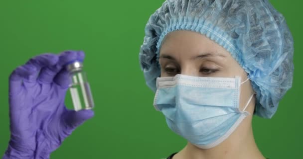 Female scientist holding ampoule in hand, new medication developing, vaccination — Stock Video