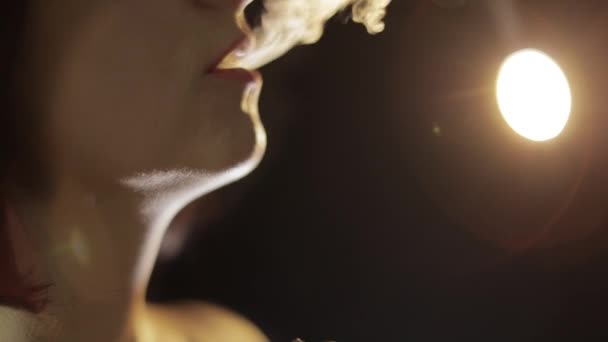 Beautiful, young woman smoking hookah. Attractive girl smoking flavored tobacco — Stock Video