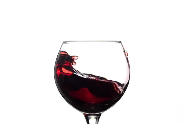 Red wine splash into glass on white background — Stock Photo, Image
