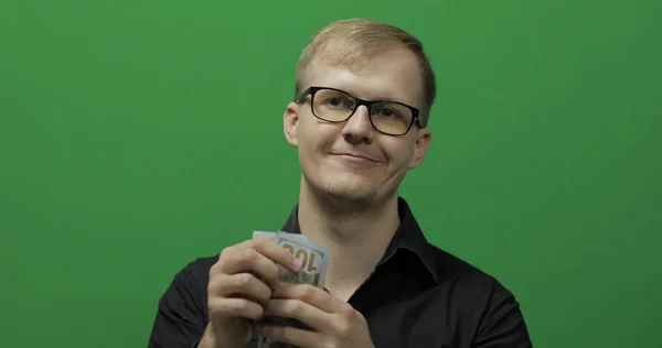 Man received paper money for a major deal. Counting money green screen