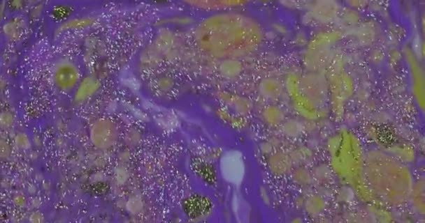 Abstract psychedelic background. Slow movement of ink in a multicolored liquid — Stock Video