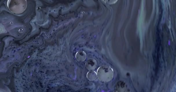 Contexte psychédélique abstrait. Mouvement lent de l'encre dans un liquide multicolore — Video