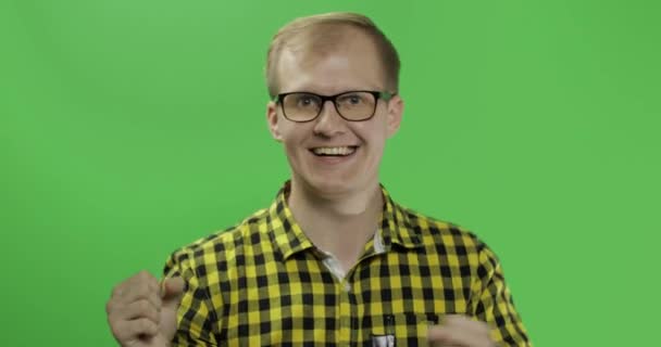 Caucasian fashionable man in glasses very emotionally celebrates something — Stock Video