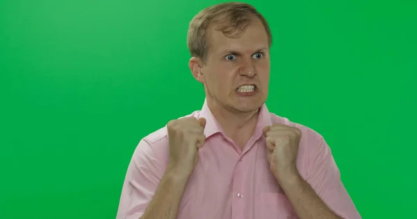 Angry aggressive young man in shirt nervous emotions. Chroma key — Stock Photo, Image