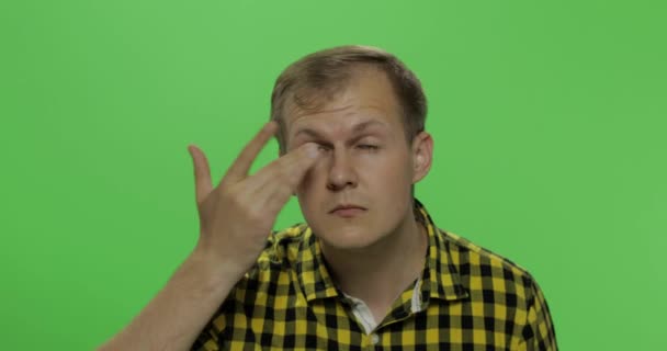 Handsome man without glasses sees poorly. Chroma key. Poor eyesight concept — Stock Video