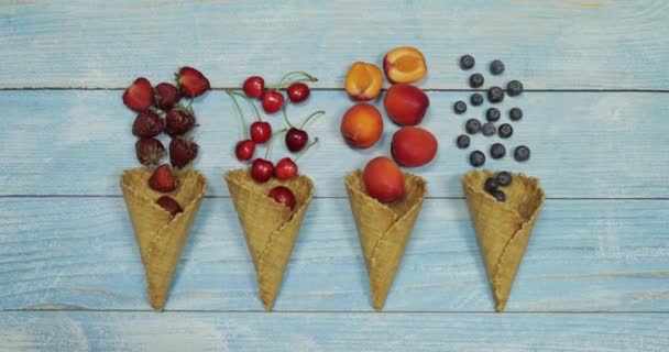 Berry and fruit ice cream. Blueberry, strawberry, cherry, apricot in a waffle — Stock Video