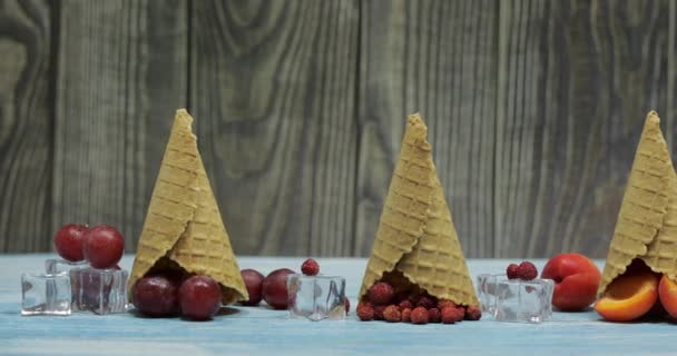 Berry and fruit ice cream. Apricot, strawberry, grape in a waffle cone — Stock Video