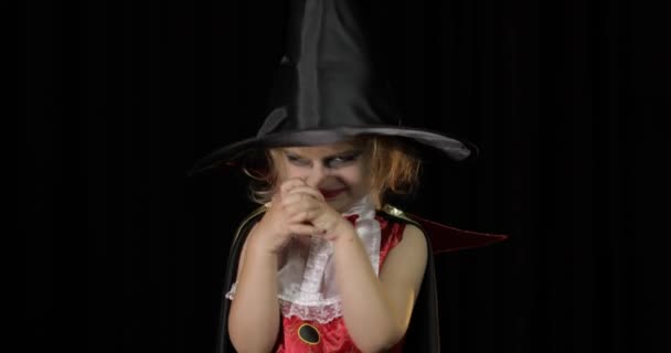 Dracula child. Girl with halloween make-up. Vampire kid with blood on her face — Stock Video