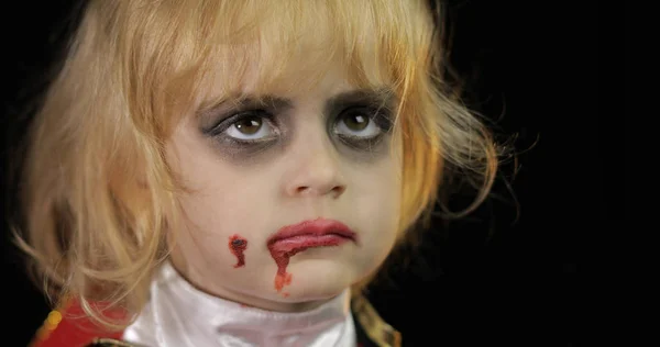 Dracula child. Girl with halloween make-up. Vampire kid with blood on her face — Stock Photo, Image