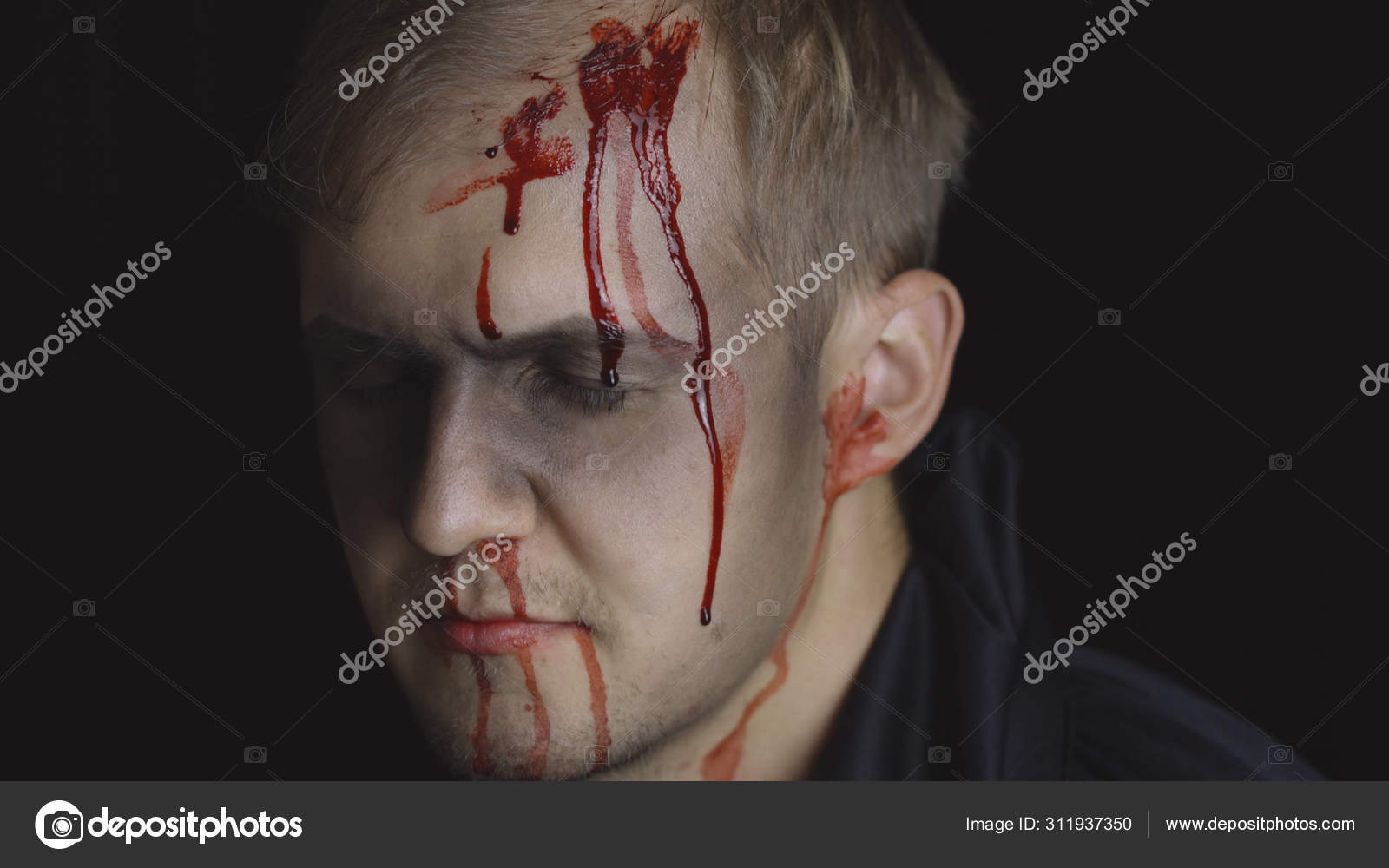 Portrait Of A Scared Girl With Blood On Her Face Looking At Camera