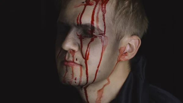 Halloween man portrait. Guy with dripping blood on his face. Scary makeup — Stock Photo, Image