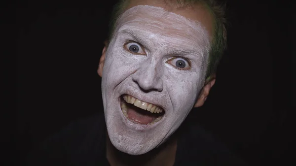 Clown Halloween man portrait. Close-up of an evil clowns face. White face makeup — Stock Photo, Image