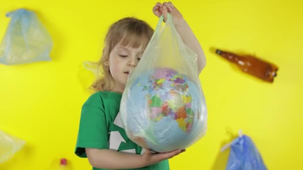 Girl activist with Earth globe in plastic package. Reduce trash pollution. Save ecology environment — Stock Video