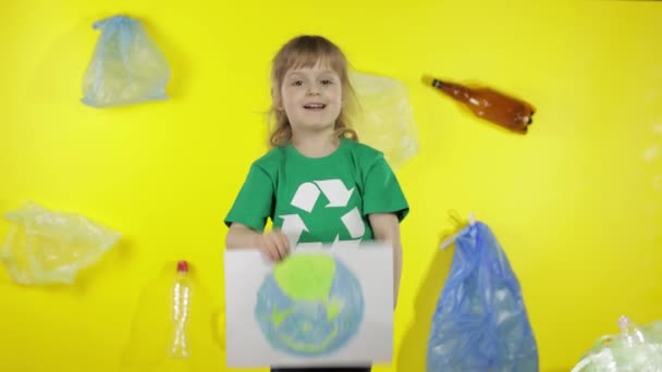 Girl volunteer holding painted picture of Earth. Plastic trash nature pollution. Save ecology — Stock Video