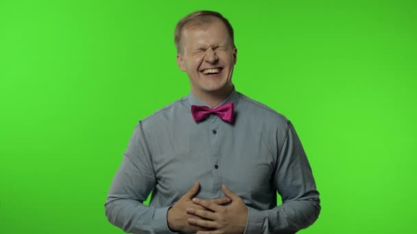 Man holding belly and laughing out loud with tears, feeling carefree joyful after hearing funny joke — Stock Video