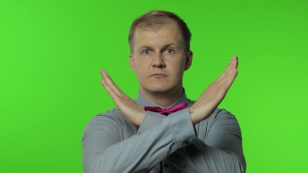 Man crossed his arms in X sign and saying no, warning of finish, prohibited access. Telling to stop — Stock Video