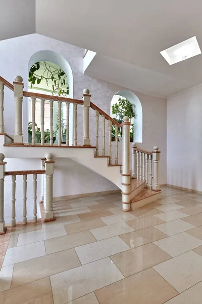staircase with wrought iron railing