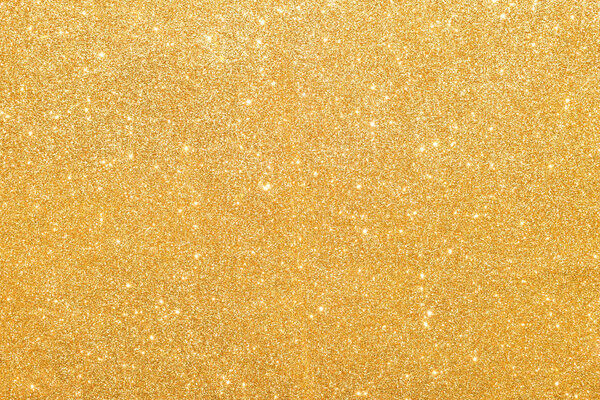 sparkles of golden glitter abstract background