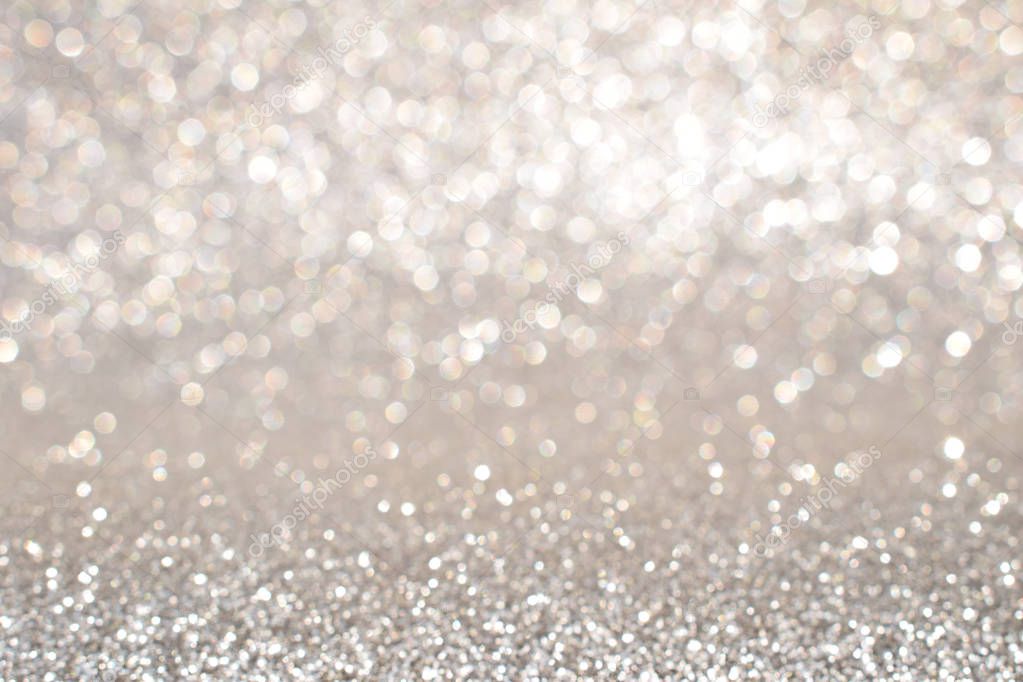 sparkles of silver glitter abstract background