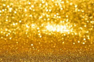 Soyut altın parıltılı arkaplan parıltıları