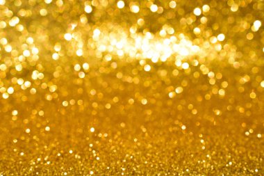 Soyut altın parıltılı arkaplan parıltıları