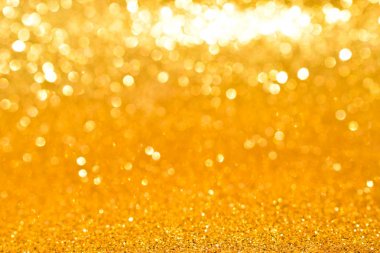 Soyut altın parıltılı arkaplan parıltıları