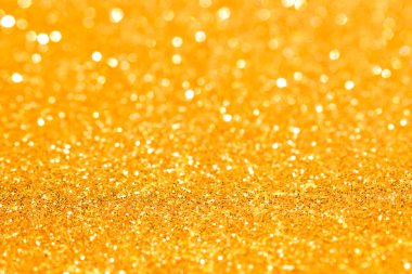 Soyut altın parıltılı arkaplan parıltıları