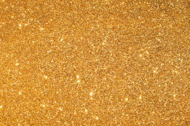Soyut altın parıltılı arkaplan parıltıları