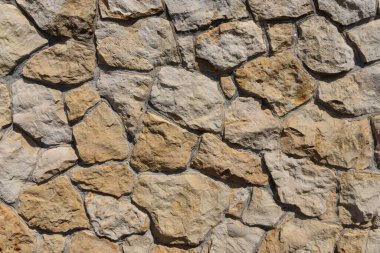 Vahşi taştan dekoratif bir duvar. Vahşi taştan dokuma dekoratif duvar. doku