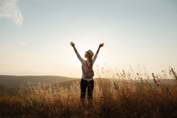 Girl raised her hands to the sky