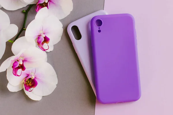 Orchid and two silicone smartphone cases.
