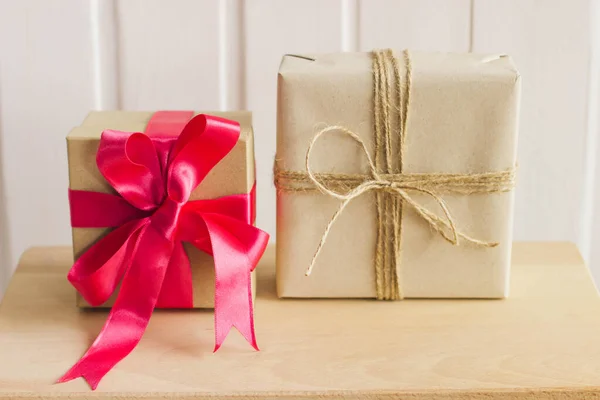 Two gift boxes on abstract background.