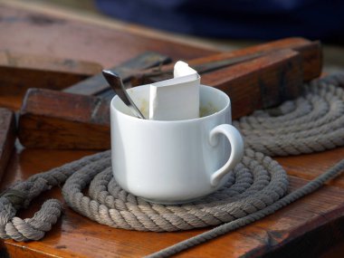 catering used coffe cup on bord a sailing ship clipart