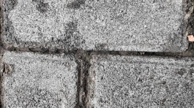 Benzersiz ve donuk beton duvar dokusu, yakın mesafeden fotoğraflanmış, yakın mesafeden, bulanık ve bulanık.