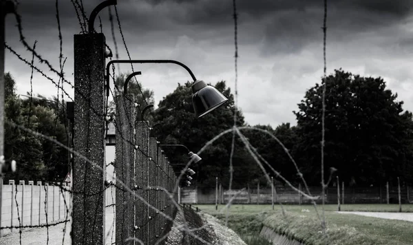 Concentration camp fence. Barbed wire net and electric fencing. Genocide, holocaust, world war, concentration camp themed design elements. — Stock Photo, Image