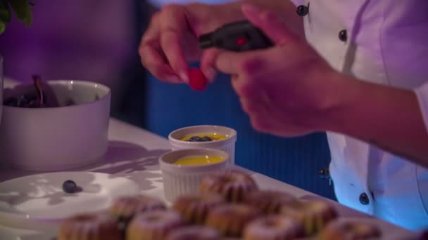 Female Chef Assistant Carefully Putting Small Pieces Fruit Vanilla Pudding — Stock Video