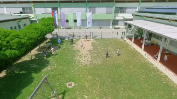 Kids Playing Ball School Some Them Swinging Swing Aerial Shot — Stock Video