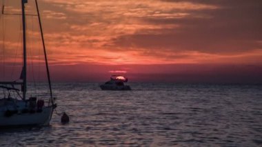 Yacht and a sunset behind it