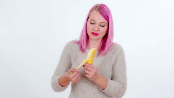 Young Woman Peeling Banana She Biting — Stock Video