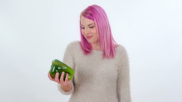 Young Woman Bites Big Green Pepper — Stock Video