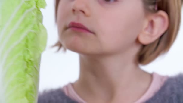 Young Girl Observing Radicchio She Biting — Stock Video