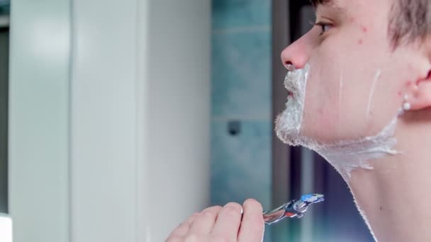 Young Man Shaving Part His Chin Neck — Stock Video