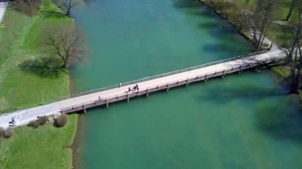 Young Attractive Man Rides Bike Crosses Bridge Full Traffic — Stock Video