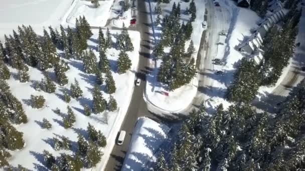 Two Vehicles Driving One Other Village Skiing Resort Aerial Shot — Stock Video