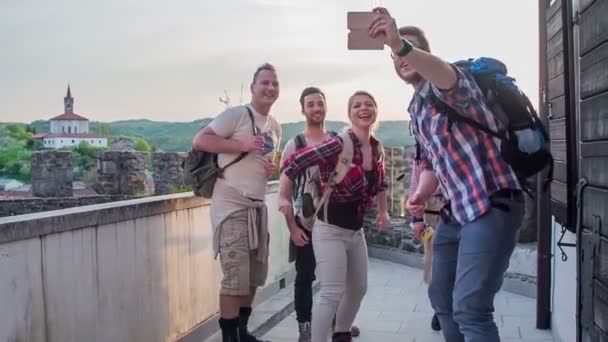 Group Young People Standing Castle Balcony Jumping Air Taking Selfie — Stock Video